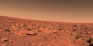 The first color picture taken by Viking 2 on the Martian surface shows a rocky reddish surface much like that seen by Viking 1 more than 4000 miles away. The right edge of the picture is due east of the spacecraft. The sun is behind the camera in the Martian afternoon. As at Chryse Planitia where Viking 1 landed in July, the sky over Utopia is pink. Colors of the rocks and soil also are almost identical at the two landing sites.