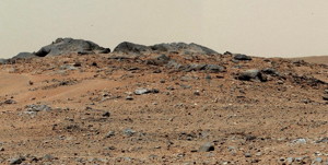The component images were taken between 11:39 and 11:43 a.m., local solar time, on 343rd Martian day, or sol, of the rover's work on Mars (July 24, 2013). A rise topped by two gray rocks near the center of the scene is informally named Twin Cairns Island. It is about 100 feet (30 meters) from Curiosity's position.